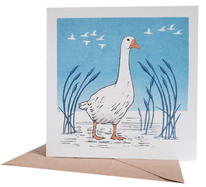 Linocut of a white Goose printed with blue and orange colours onto recycled card