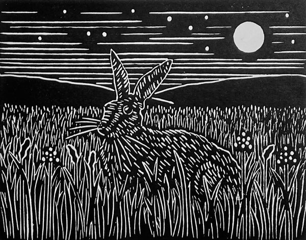 Linocut image in black ink of hare sitting on grass under moonlit sky
