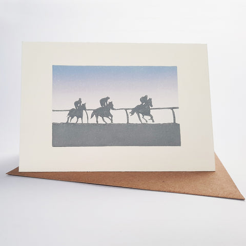 Linocut greeting card of racehorses on the gallops
