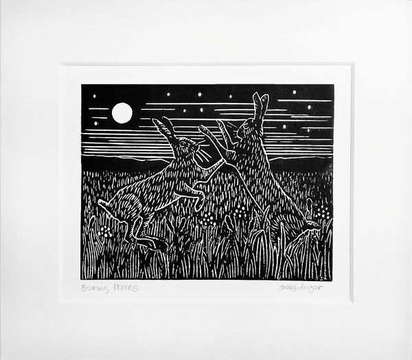 Boxing Hares linocut in black ink with mount