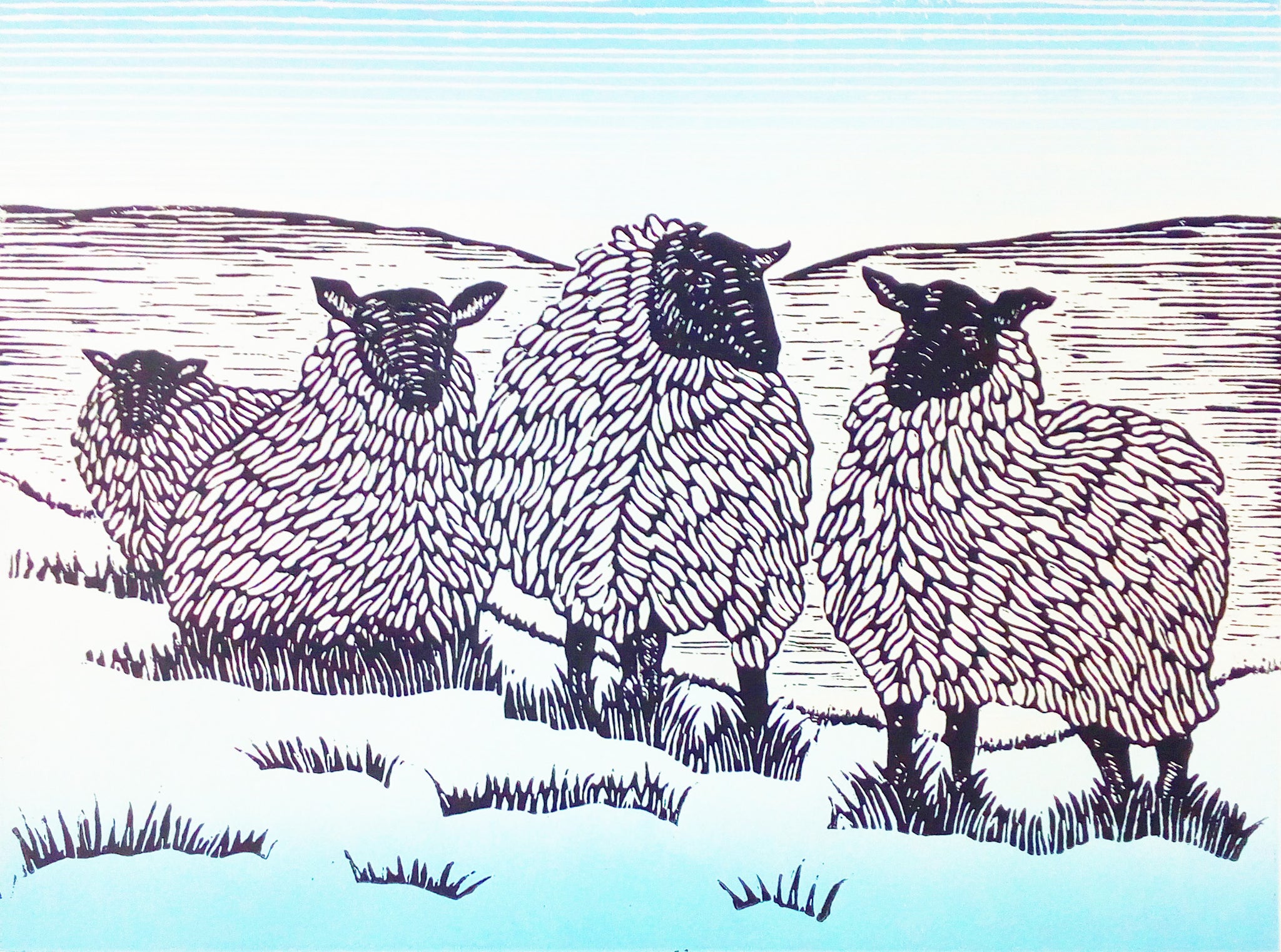 Lino print of woolly sheep on a hillside